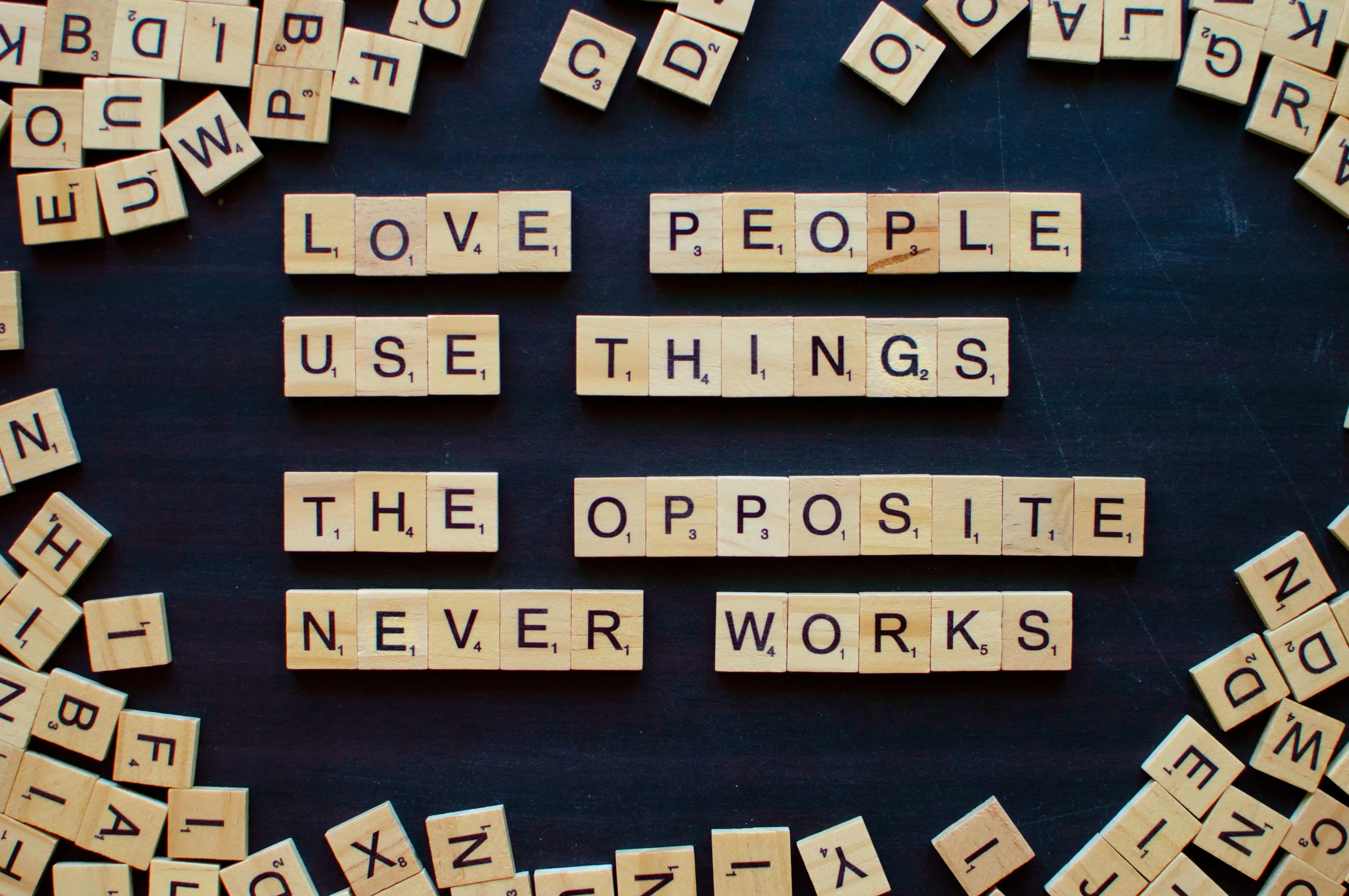 wooden-blocks-quotation-love-people-use-things-letters