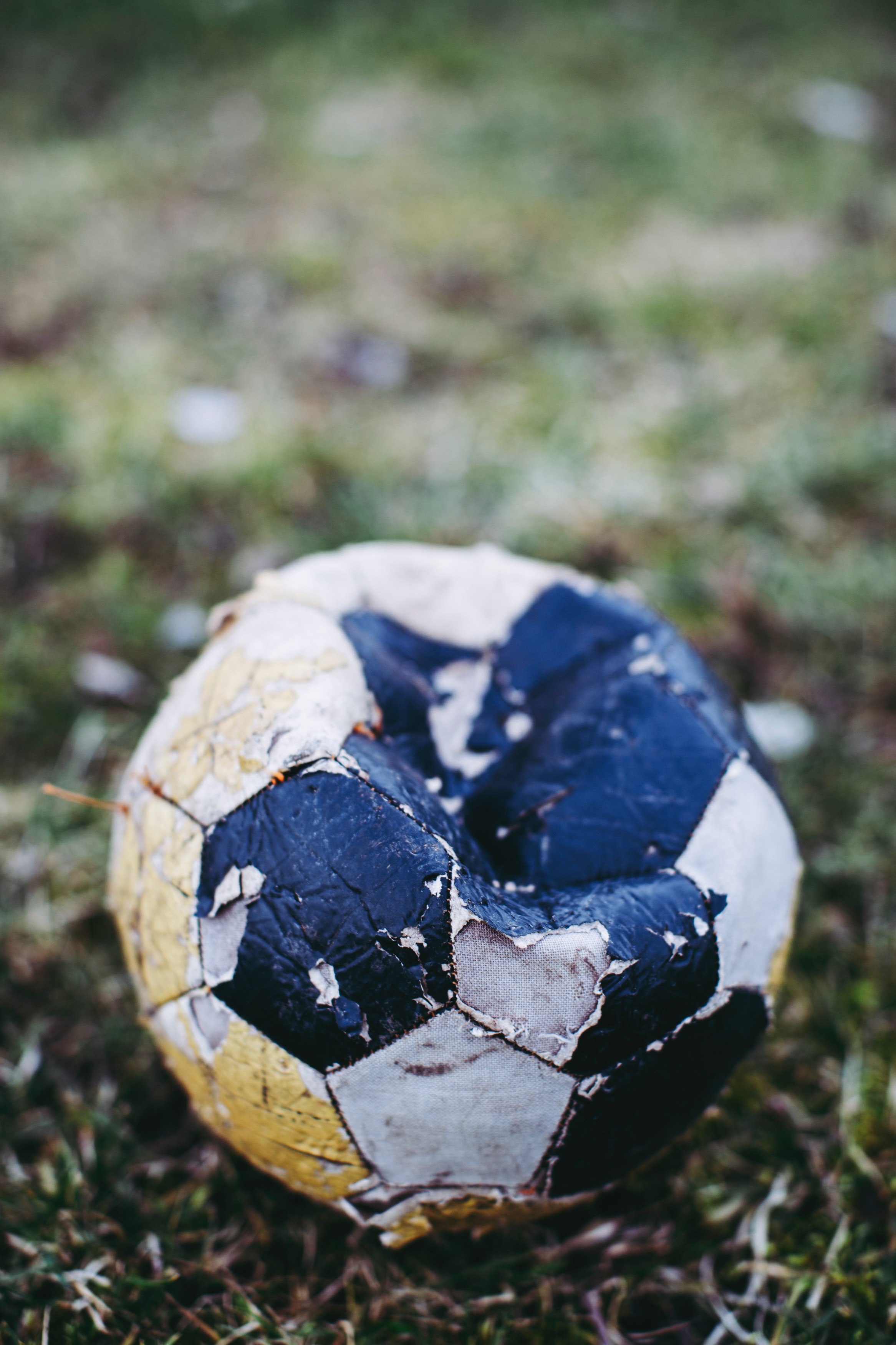 old-dirty-ball-on-grass